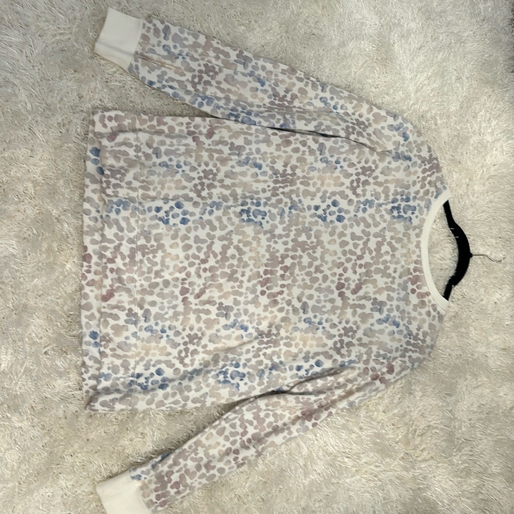 Stars above sweatshirt.